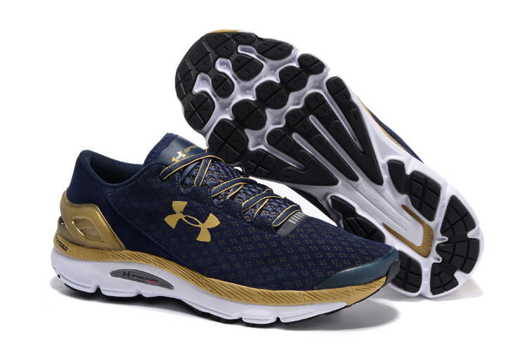 gold and white under armour shoes